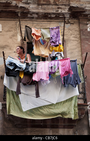 A lady taking care of her wash, Havana (La Habana), Cuba Stock Photo