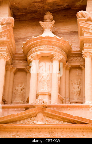 Detail (with bullet damage) of the front / top part of 'The Treasury': Al Khazneh / El Khazneh, at lost city of Petra in Jordan. Stock Photo