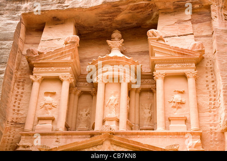 Detail (with bullet damage) of the front / top part of 'The Treasury': Al Khazneh / El Khazneh, at lost city of Petra in Jordan. Stock Photo