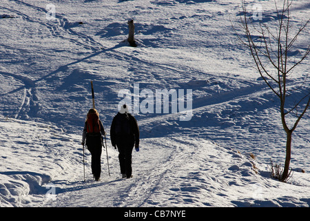 Hiking through the Alps in winter Stock Photo