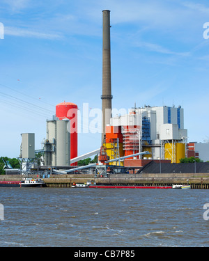 Coal-fired power plant located on a river. Stock Photo