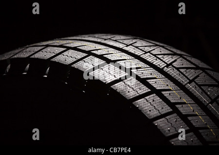 Part of brand new car tyre. Horizontal composition. Stock Photo