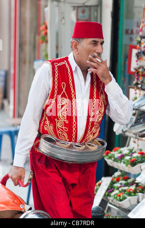 Tea seller taking a break in Istanbul, Turkey. Stock Photo