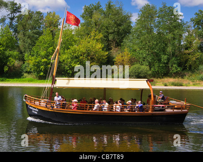 Tourist boat on the Dordogne River, France - at La Roque Gageac - with tourists on a sightseeing trip in summer Stock Photo