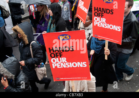 One day strike against pension cuts by public sector workers.PCS union members march in the demonstration with flags. Stock Photo