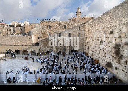 Jewish believers pray by the Wailing wall in the old city of Jerusalem. Stock Photo