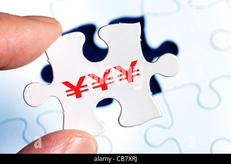 Puzzle and Chinese Yuan sign, business concept Stock Photo