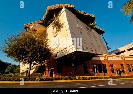 WonderWorks I-Drive attraction upside-down building with auto for size comparison, Orlando, Florida Stock Photo