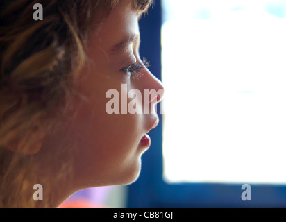 Child girl profile portrait in white window background Stock Photo