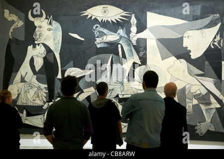 Visitors admire Guernica, Pablo Picasso 1937 Museo Nacional Centro de Arte Reina Sofía Reina Sofia Museum of Modern Art Madrid Stock Photo