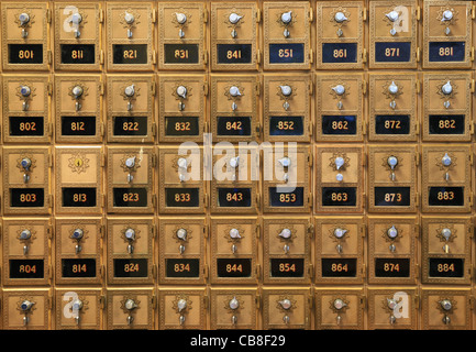 an array of old mail boxes in a post office Stock Photo