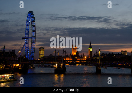 London skyline at sunset with view of Thames, Houses of Parliament, London Eye Stock Photo