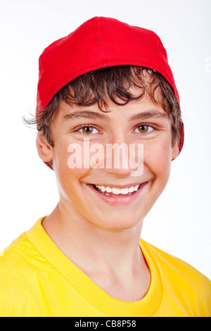 portrait of a teenage boy in red baseball cap smiling -isolated on white Stock Photo