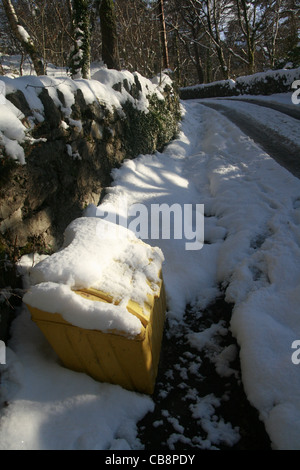 rural road covered with snow in wales great britain uk Stock Photo