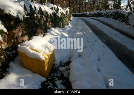 rural road covered with snow in wales great britain uk Stock Photo