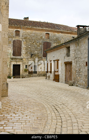 French village street with cobbled road Stock Photo