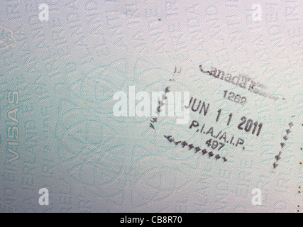 canadian border entry visa stamp in an eu irish passport Stock Photo