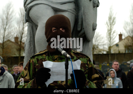 A member of the dissident Real IRA reads a statement at a 1916 Easter Rising commemoration in Londonderry, Northern Ireland. Stock Photo