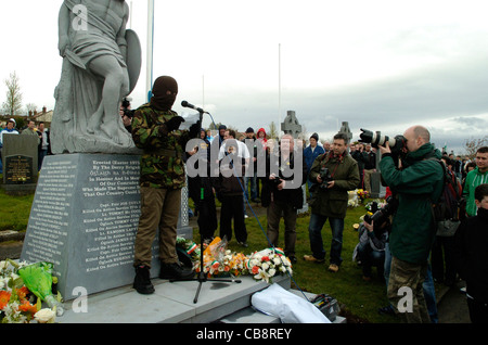 A member of the dissident Real IRA reads a statement at a 1916 Easter Rising commemoration in Londonderry, Northern Ireland. Stock Photo