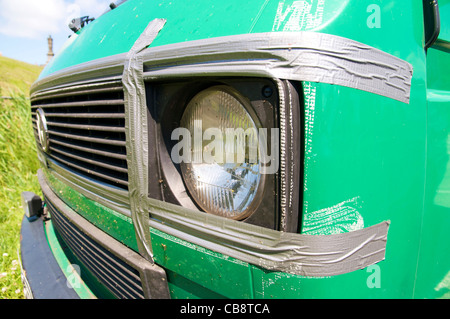 Old Volkswagen bus held together by tape. Stock Photo