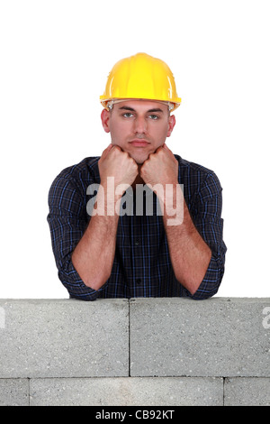 Bored construction worker Stock Photo