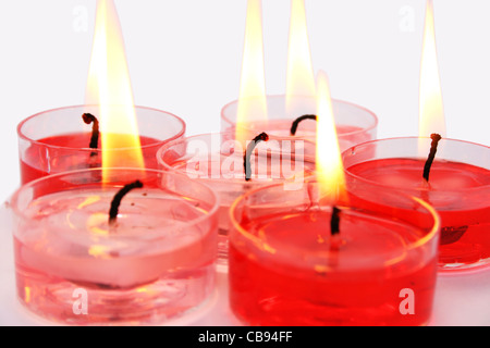 Red and pink candles isolated on gray background. Stock Photo