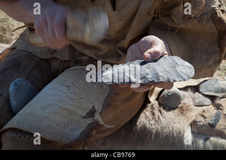 Neolithic re-enactment. Stone Age man with antler horn tipped fish ...