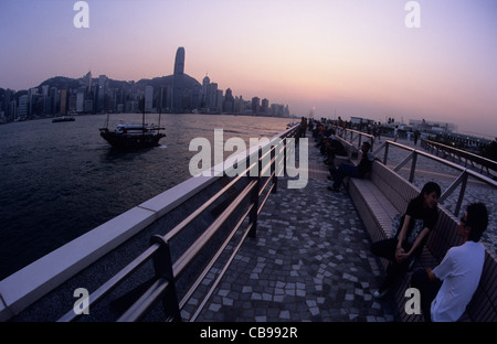 Hong Kong, Kowloon, watching the sunset from the waterfront. Stock Photo