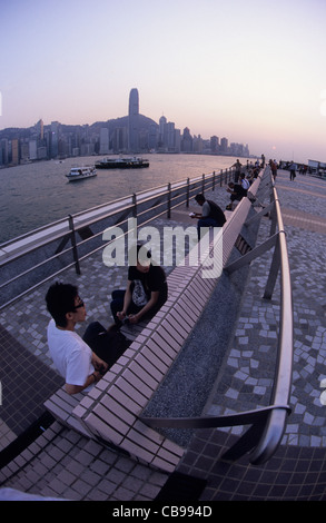 Hong Kong, Kowloon, watching the sunset from the waterfront. Stock Photo