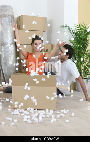 couple amid boxes Stock Photo