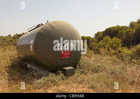 Water tank containing water with chemical additives used for fire control in forest near St-Chinian Herault Languedoc France Stock Photo