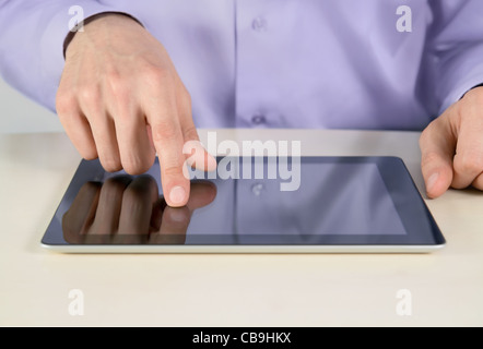 Closeup shot of businessman hand are touching on digital tablet pc. Shallow depth of field on finger. Stock Photo