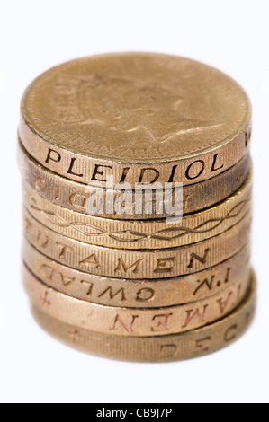 a small pile of british one pound coins isolated on a white background Stock Photo