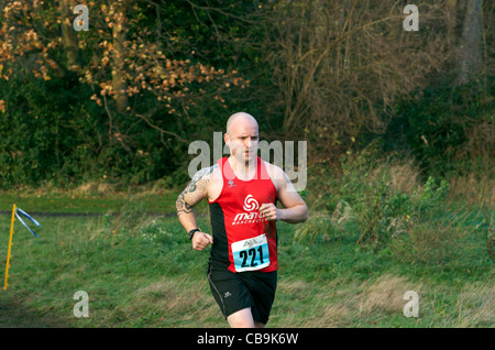 cross-country runner at wythenshawe park, manchester Stock Photo