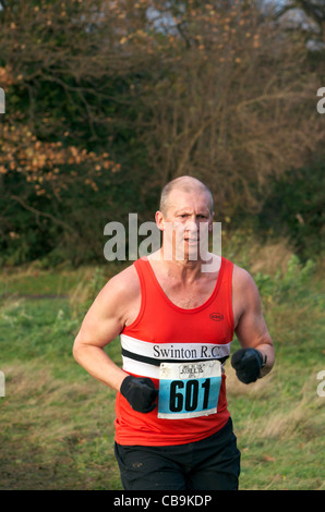 cross-country runner at wythenshawe park, manchester Stock Photo