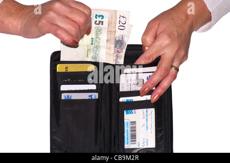 Womans Females persons Hands Taking Sterling Money Notes From A Purse Stock Photo