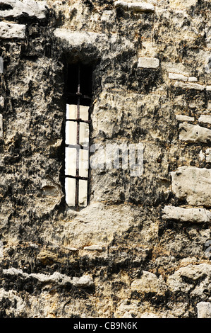 Arrow slit window in old brick castle wall Stock Photo - Alamy