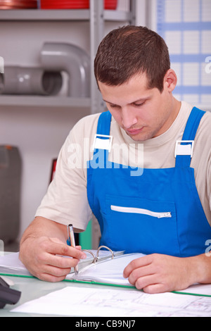 Builder looking at paperwork Stock Photo