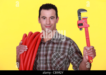 Workman on yellow background Stock Photo