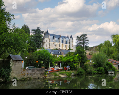 Chateau de Montresor and riverbank garden next to the Indrois river in small village of Montresor, Loire, France Stock Photo