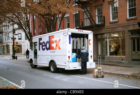 A FedEx employee sorts packages for delivery in Greenwich Village in New York Stock Photo