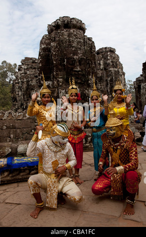 Local people in authentic costumes near the famous Bayon Temple in Cambodia