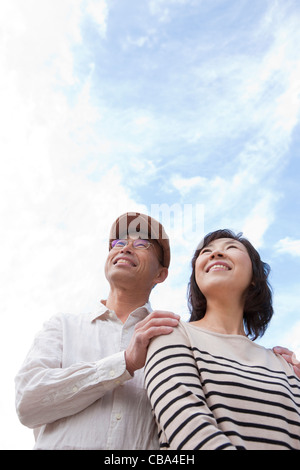 Mature couple looking up Stock Photo