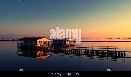 Traditional wooden fishermen houses on stilts in Greece, lagoon of Messologi Stock Photo