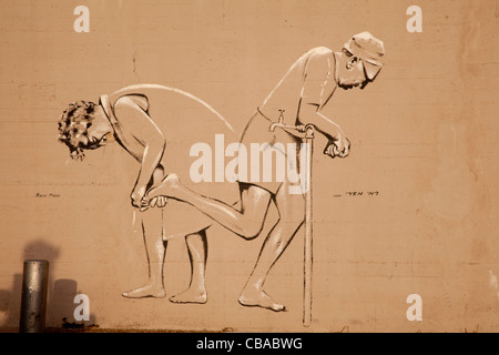 Wall painting of elderly couple on a beach wall in Tel Aviv Israel Stock Photo