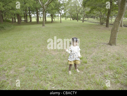 Girl playing in a park Stock Photo