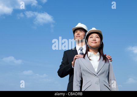 Two Businesspeople at Construction Site Stock Photo