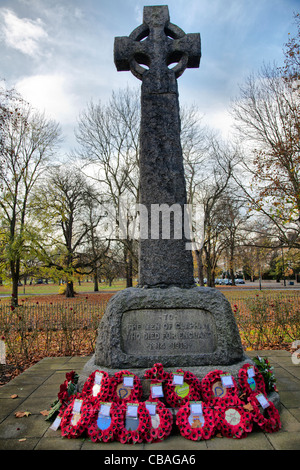 Veterans Day Commemoration at WWI Memorial Cross outside Holy Trinity Church - Clapham Stock Photo