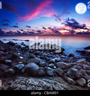 Full moon fantasy seascape. Long exposue shot, square composition. Stock Photo