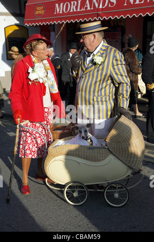 COUNTRY LADY & GENTLEMAN WITH WHIPPET IN PRAM PICKERING NORTH YORKSHIRE 15 October 2011 Stock Photo